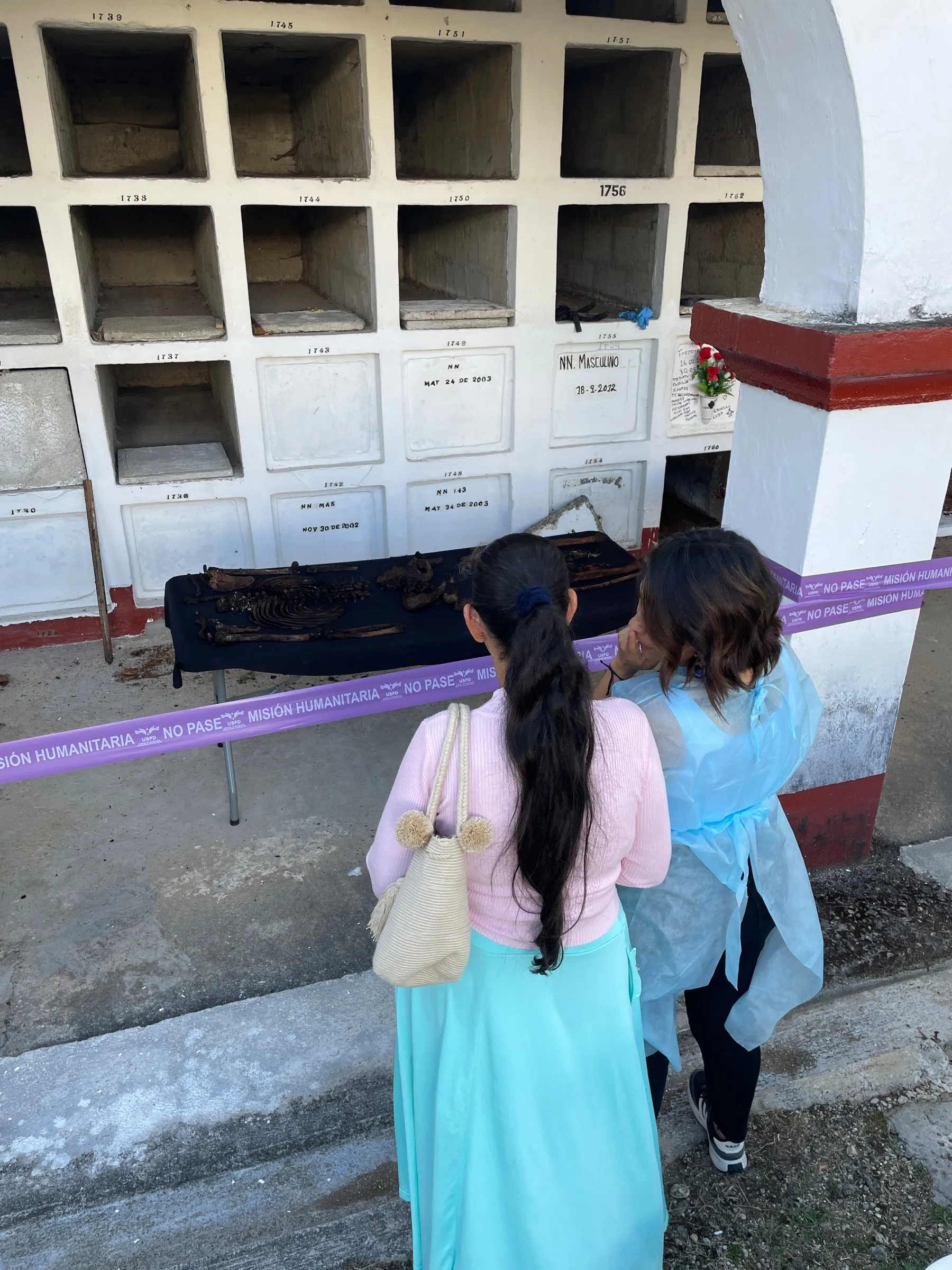 Roselly Gil observes remains she hopes belong to her disappeared brother.
